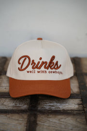 DRINKS WELL WITH COWBOYS