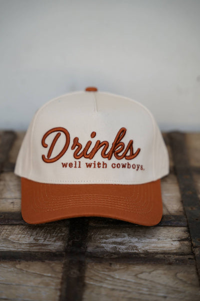 DRINKS WELL WITH COWBOYS