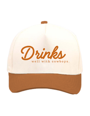 DRINKS WELL WITH COWBOYS